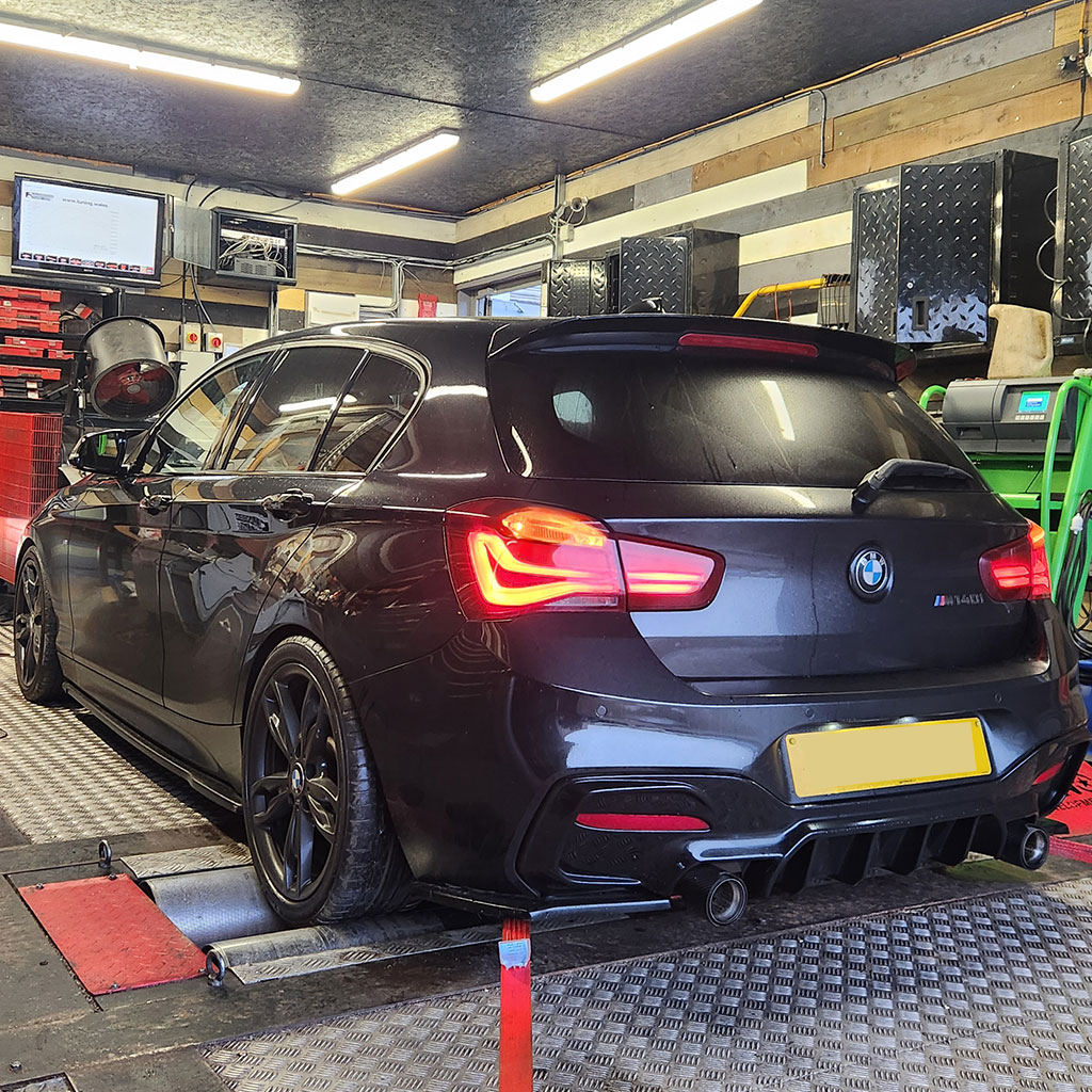 Vehicle positioned for rolling road testing